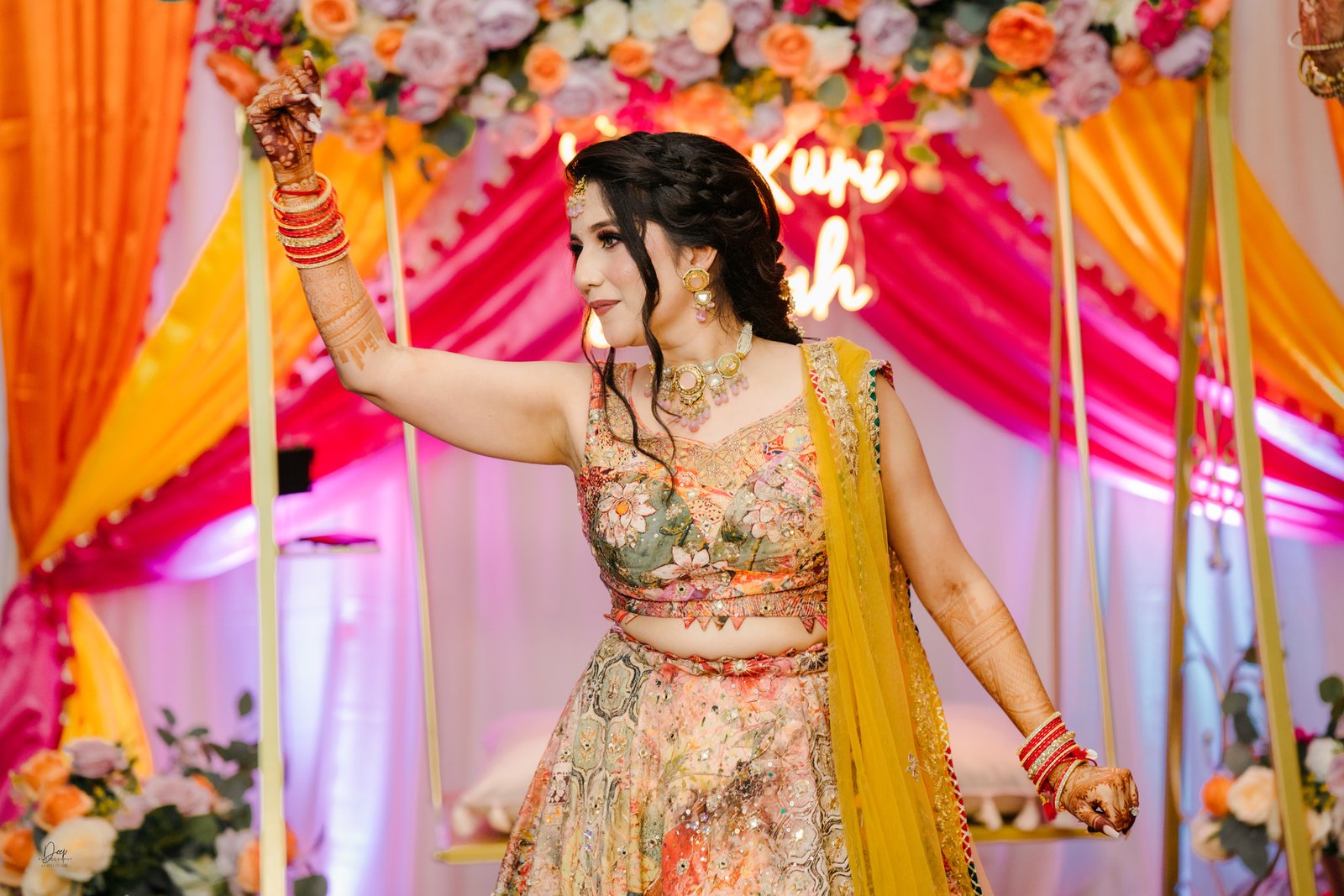 Bride showcasing intricate Mehndi designs on hands